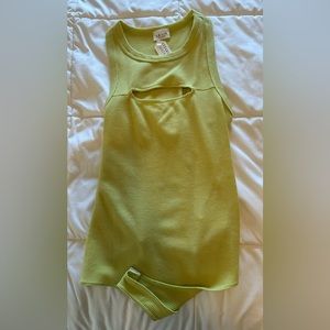 Waffle material sleeveless thong body suit with cut out on upper chest